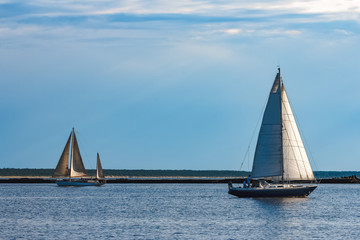 Poster - Blue sailboat at river