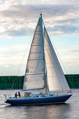 Sticker - Blue sailboat against cargo ship