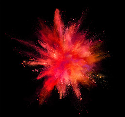 Wall Mural - Coloured powder explosion isolated on black background