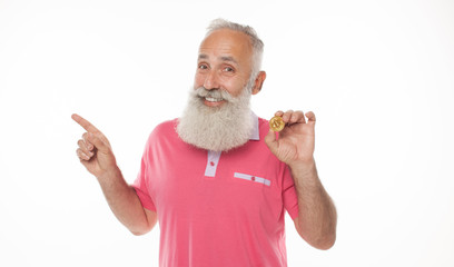 Aufkleber - Gold Bitcoin in funny bearded man hand, Digital symbol of a new virtual currency.