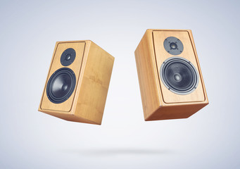 Two wooden speakers on light blue background. File contains a path to isolation. 