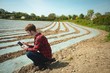 © Wavebreak Media - Man using digital tablet in the field