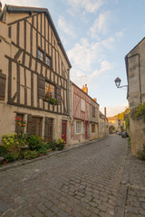 Square with half-timbered houses, in the medieval village Noyers-sur-Serein