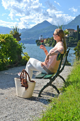 Wall Mural - Girl with a wineglass at the Como lake, Italy