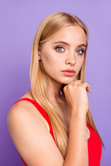 Portrait of attractive blonde student gorgeous girl wearing red swim suit. Isolated over violet pastel background