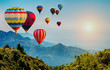 Beautiful view of mountain with hot air balloons on morning at Thailand.