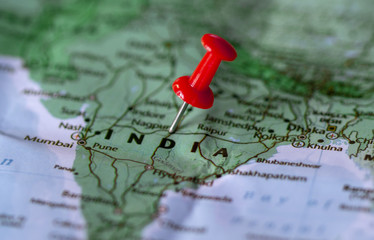 close up the county of india on world map,pushpin marking of india map