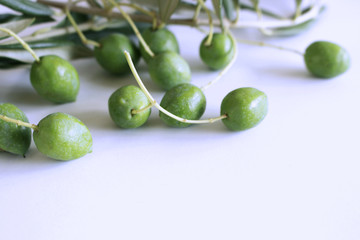 Sticker - Fresh green olives isolated on white background close up.Blurred background.