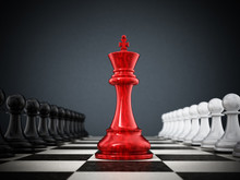 Red Chess King Standing Between White And Black Pawns. 3D Illustration