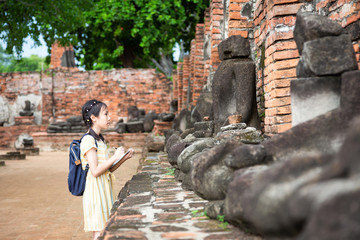 asian young girl is study and learning antiquities,field trip,a trip outside of the school(wat mahat