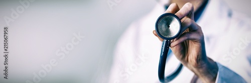 Doctor holding stethoscope Tableau sur Toile