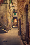 Fototapeta Na drzwi - Narrow street of medieval ancient tuff city Pitigliano, travel Italy background