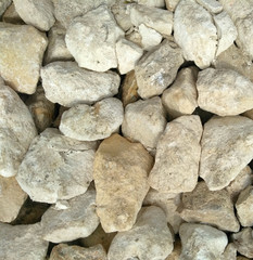 white stones. it is a lot of stones. texture. background.