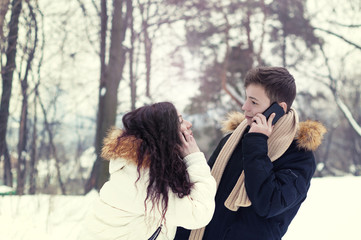 young people on a walk in a winter park