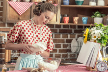 Beautiful Adult Housewife Pouring Flour Into Bowl For Dough At Kitchen