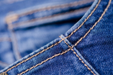 Blue jeans fabric macro texture fashion on blur background