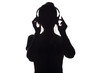 silhouette of a girl listening to music in headphones on a white isolated background