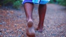 In This Close Up Type Of Footage You Can See Person Walking On Rough Stone Pathway In Barefoot. Location: Curacao Island.