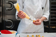 © Liz Clayman - Chef piping filling into pastry