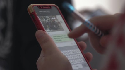 Poster - Smartphone in children's hands. Stock. Smart phone in the hands of a child