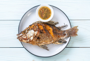 Fried fish with spicy seafood sauce