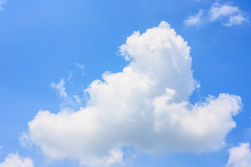 Wall Mural - fluffy cloud against blue sky background