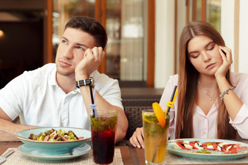 Wall Mural - Couple having relationship problems, talking in a cafe