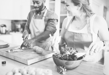 Wall Mural - A couple is cooking in the kitchen