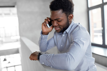 Sticker - business, technology, communication and people concept - african american businessman calling on smartphone at office