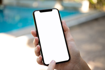 female hands holding phone with isolated screen on background pool