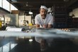 © Wavebreak Media - Portrait of male baker standing in bakery shop