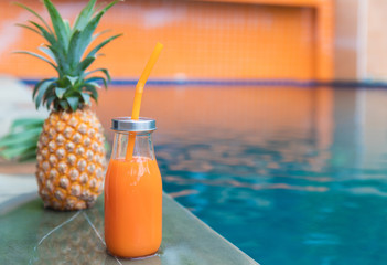 Wall Mural - Fresh yellow pineapple tropic fruit summer refreshment smoothie shake drink near pool