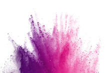 Abstract Of Colored Powder Explosion On White Background. Freeze Motion Of Purple Powder Exploding On White Background. Colored Cloud. Colored Dust.