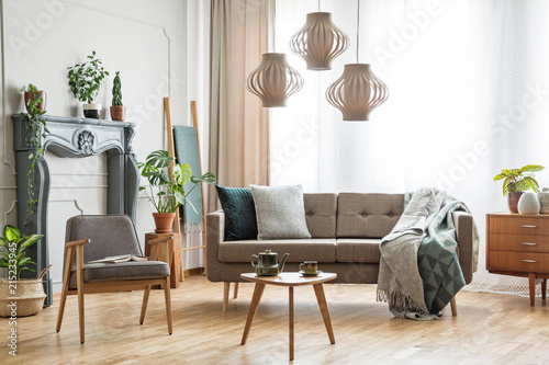 Real Photo Of A Sofa With Pillows And Blanket Standing Next