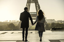 Couple Walking Towards Eiffel Tower