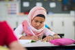 © Rido - Young girl wearing hijab studying