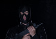 © serikbaib - man in a black mask with a gun