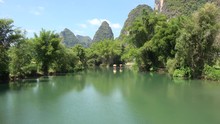 Tourists Ride On Bamboo Rafts At Li River. Yangshuo, Guilin, Guangxi Zhuang, China 