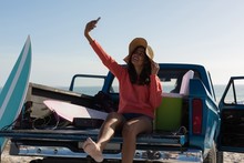 Woman Taking Selfie With Mobile Phone In A Pickup Truck