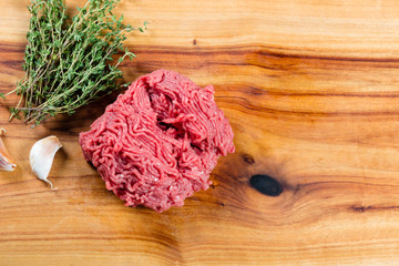 Wall Mural - Raw lean beef mince on chopping board