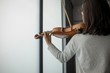 © Wavebreak Media - Schoolgirl playing violin in music school