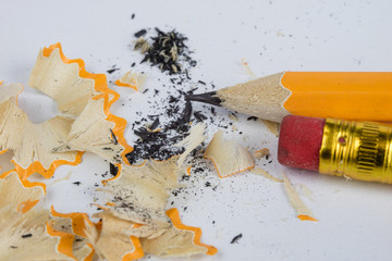 Pencil and sharpener on a white table. Accessories for drawing and sketching.