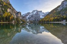 Croda Del Becco (Seekofel) Reflected In The Still Waters Of Braies Lake In Autumn In The Prags Dolomites, South Tyrol, Italy