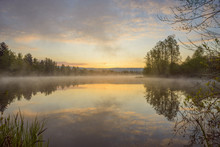 Pastel Sky Reflected In Lake With Morning Mist At Dawn In Mondfeld, Wertheim In Baden-Wurttemberg, Germany