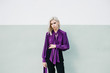 © jadiezlo/Stocksy - Woman posing in purple blouse