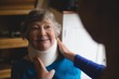 © Wavebreak Media - Physiotherapist setting cervical collar on senior woman