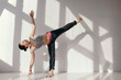 © Sergey Filimonov/Stocksy - Flexible woman in yoga pose