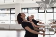 © Wavebreak Media - Group of women stretching holding the barre
