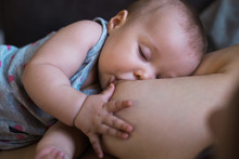 Mother Breast Feeding A Baby