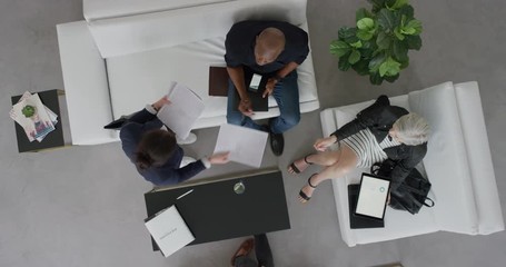 Wall Mural - professional group of business people meeting entrepreneur sharing corporate proposal multi ethnic executives collaborating overhead view